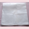 A very large damask napkin monogrammed EC