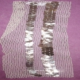 Three lines of old sequins on white net - EBD 40